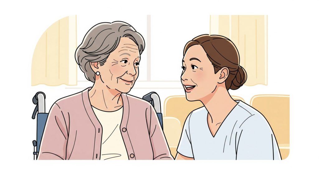 車椅子に座っているおばちゃんに話しかける介護士